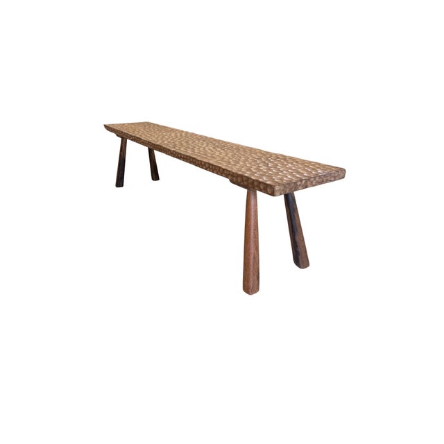 Crafted from reclaimed solid teak, this sculptural bench showcases an extraordinary balance between organic materiality...