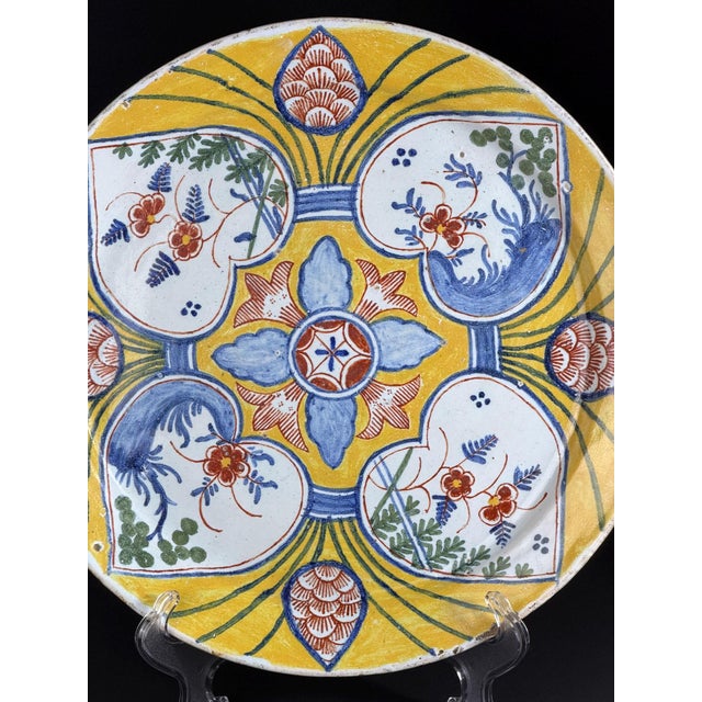 Exceptional large Dutch Delftware plate dating to the 18th century, featuring the highly sought-after yellow-ground “four...