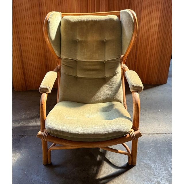 Nice rattan armchair with ligth green velvet upholstery