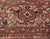 This circa-1920 antique Sultanabad rug features an all-over design of floral abstractions in shades of red, brown and...