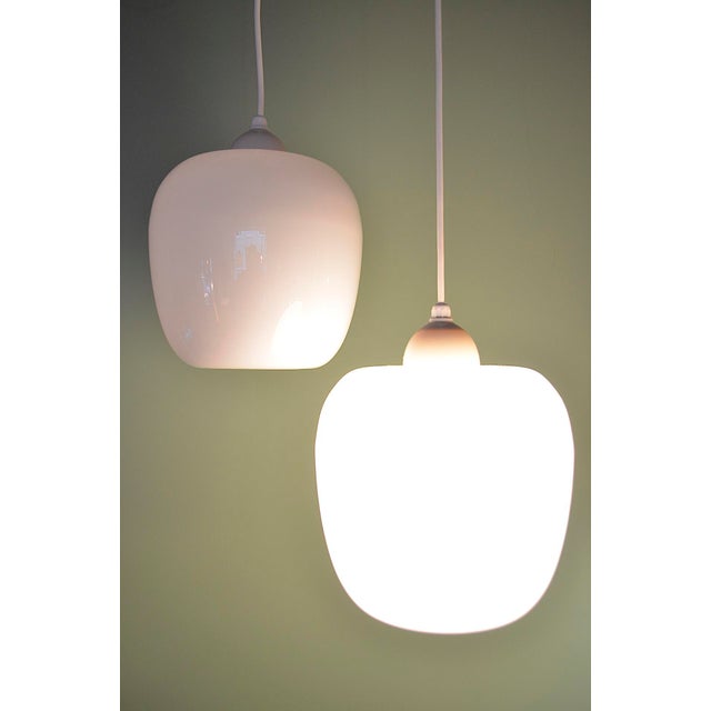 Mid-century opal glass pendant lights from the 1950s-1960s Origin: Denmark The lights are made of thin opal glass, topped...