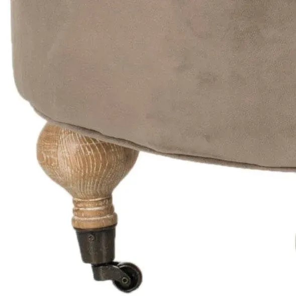 Classic and elegant, the generously padded and tufted round ottoman is crafted from solid wood in pickled oak finish. Soft...