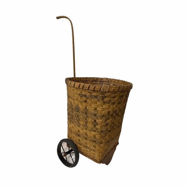 Mid century split wood rolling french market basket. Measures 15” diameter x 36” tall to top of handle, 20” basket height.