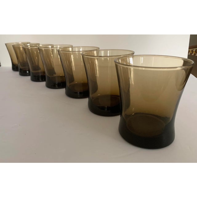 Mid Century Modern shaped glasses. Smoky Brown with a weighted base. Manufactured by Linden Moka Anchor Hocking . Unmarked.