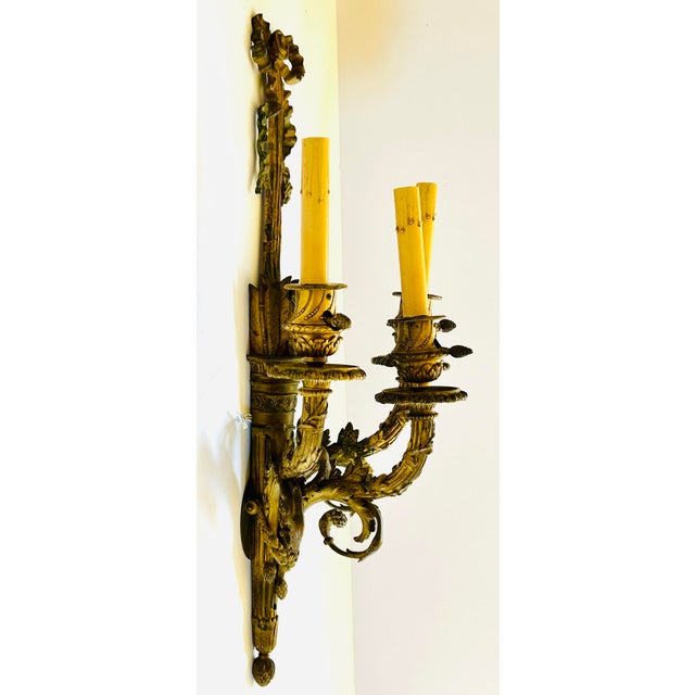 Single antique French bronze 3-arm wall sconce professionally rewired. Central wheat sheath motif, scrolled arms and...