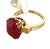 Centering an 8.34 carat natural ruby, this striking ring features an emerald-cut stone with a rich semi-transparent...