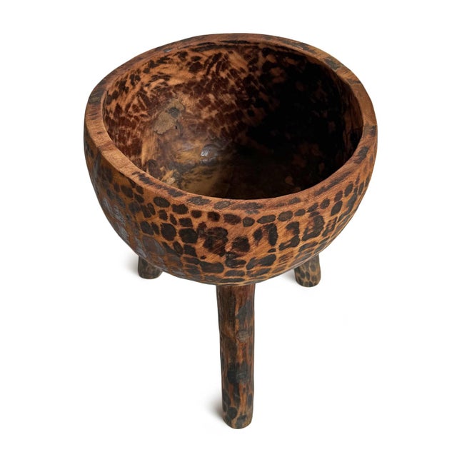 Vintage hand carved wooden bowl on three tall legs. Unique piece for display on its own or filled with items of your...