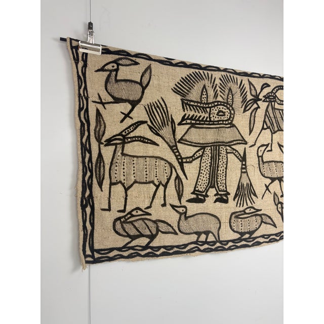 Attributed to the Senufo style of Northern Côte d'Ivoire, this late 20th-century Korhogo cloth is a hand-woven African...