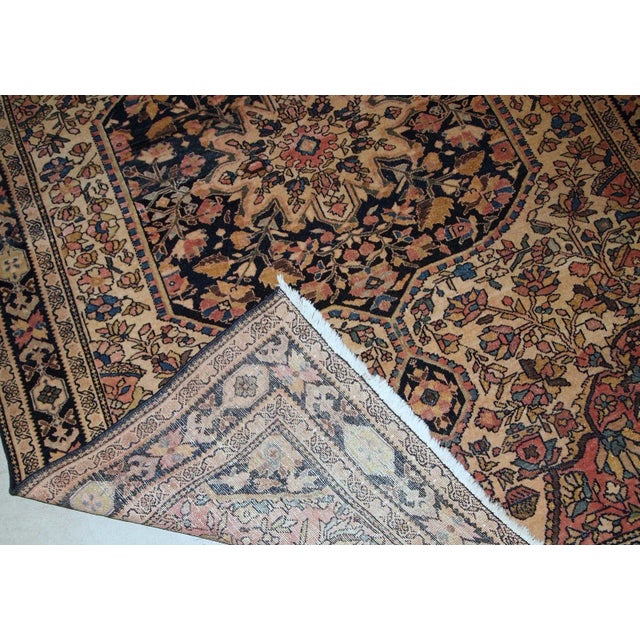 Handmade antique Sarouk Farahan rug in original good condition, has some low pile. The rug has been made in the beginning...