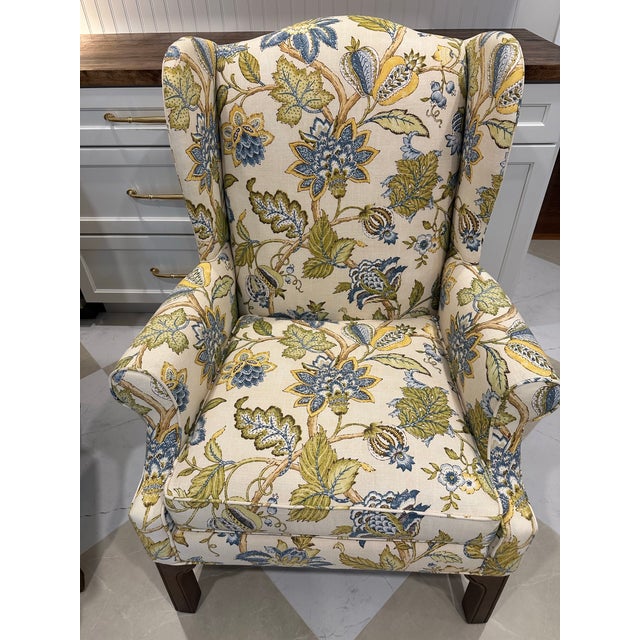 Exceptional pair of American-made C.R. Laine Furniture wingback chairs, dating to 2008 and retaining their original...