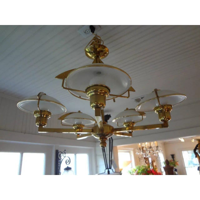 Unusual Italian Mid-Century Modern Stilnovo style five-light brass chandelier with glass shades. Newly wired for U.S....