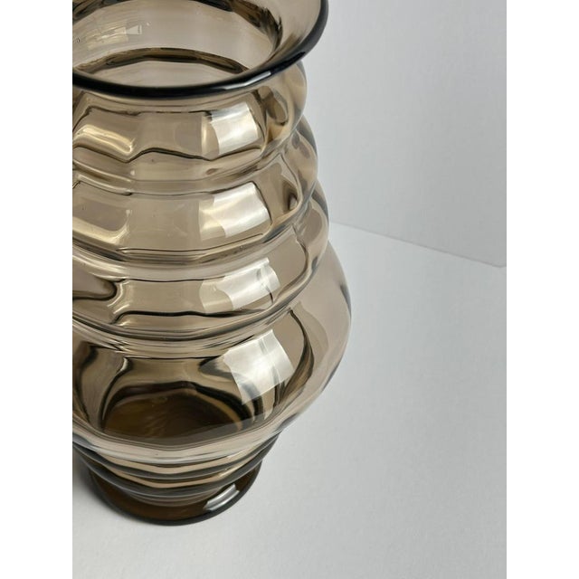 This Swedish Art Deco smoked glass vase, designed by Edward Hald for Orrefors and produced at the Sandvik branch in 1923,...