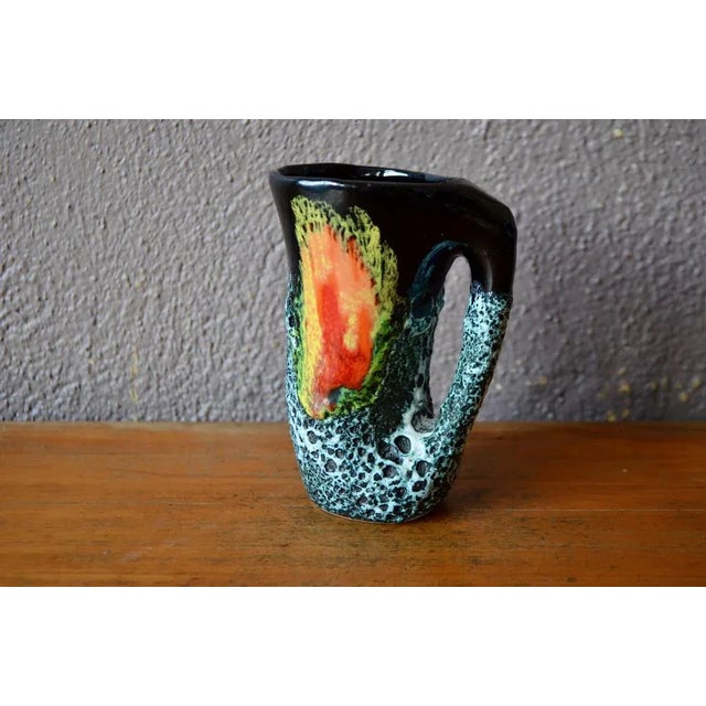 Thick email, bright colors and thick drips, this small pitcher -shaped vase is vintage production. Typical of Fat Lava...