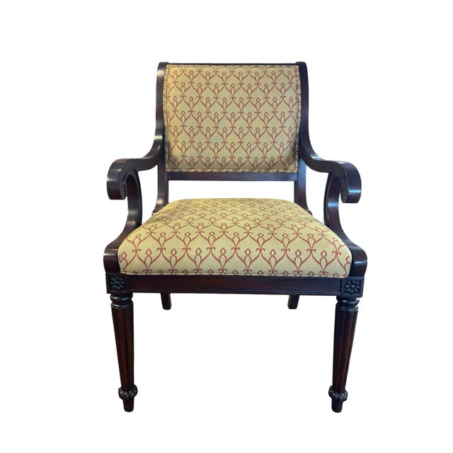 This Drexel Heritage arm chair features the classic Empire or Regency style. characterized by its elegant mahogany frame,...