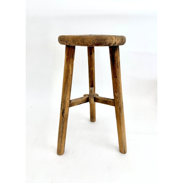 Antique three legged rustic farm stool hand-constructed from elm wood using the mortise and tenon method. Age and...