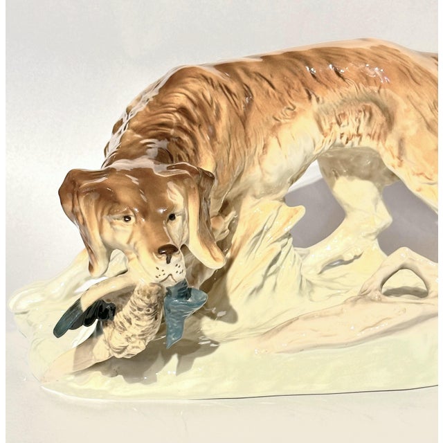 Vintage large porcelain hunting dog with pheasant by Royal Dux made in Czechoslovakia, circa 1940s. It is in excellent...