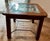 Solid wood frame with exposed pegs/fasteners Inset glass top (not just resting on top) Hand-forged style metal grid under...