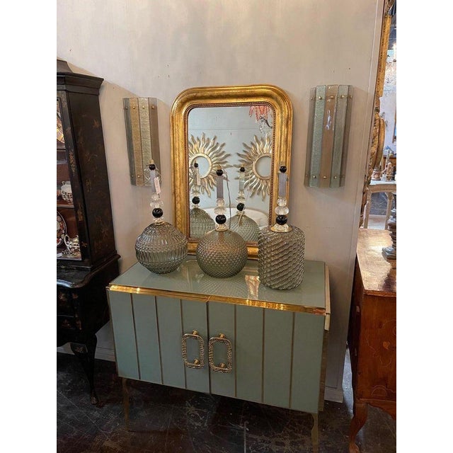 Elegant pair of modern Murano glass sconces. Beautiful colored glass in champagne and silver. Makes a beautiful statement!!