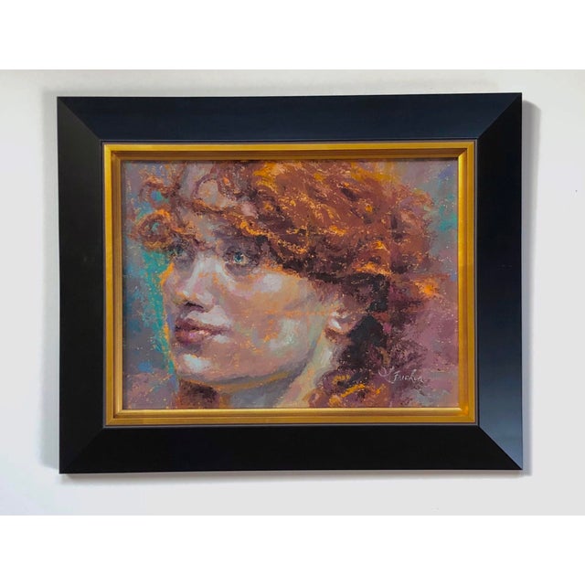 This artwork showcases a luminous portrait of a figure with striking red curls, capturing a moment of introspection. The...