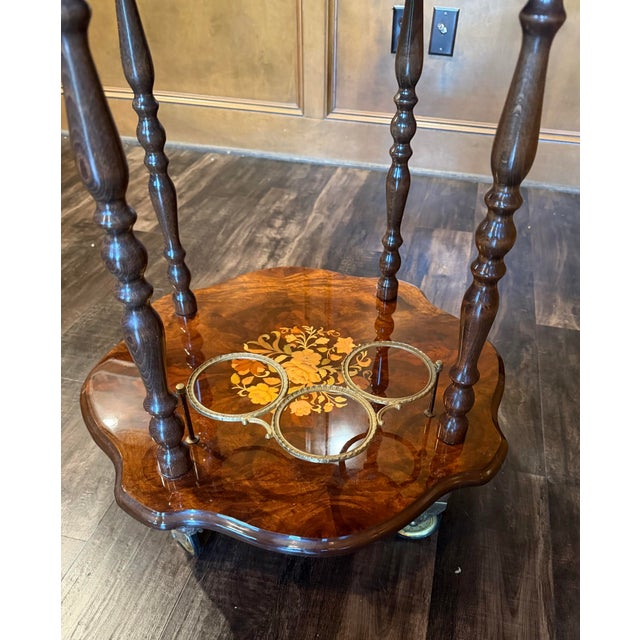 An elegant Italian inlaid marquetry bar cart, purchased in Italy and crafted in the classic European decorative tradition....