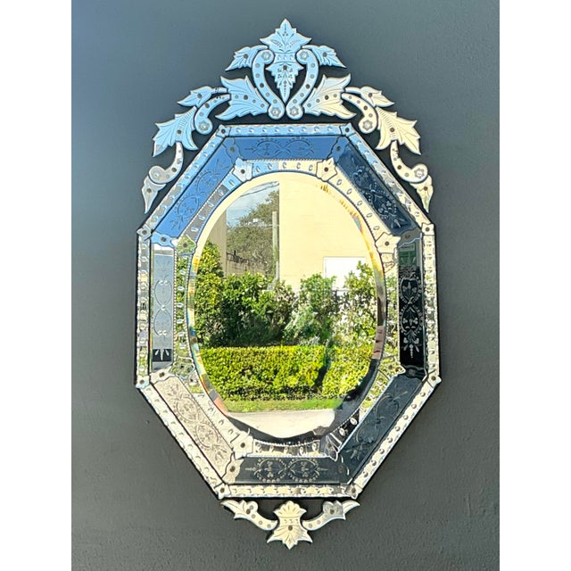 This exquisite Venetian-style wall mirror is a masterwork of Italian craftsmanship, embodying the glamour and...