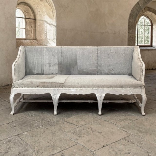 A rare and authentic 18th century Swedish Rococo bench of impressive scale, this beautifully preserved example captures...