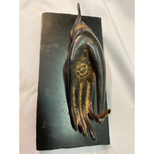 This is a most unusual Art Nouveau incense burner. The hand I believe to be bronze sits on a separate black metal base...