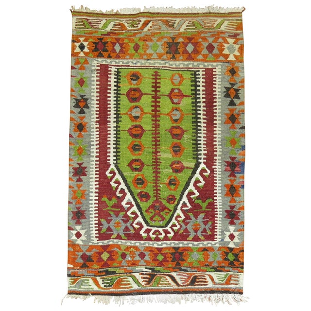Colorful mid-20th century Turkish flat-weave Kilim with prayer motif. Measures: 2'11" x 4'6".