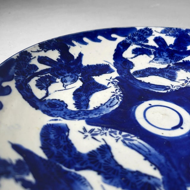 A beautiful Japanese porcelain plate from the late Edo to early Meiji period, crafted in Arita, Saga Prefecture....
