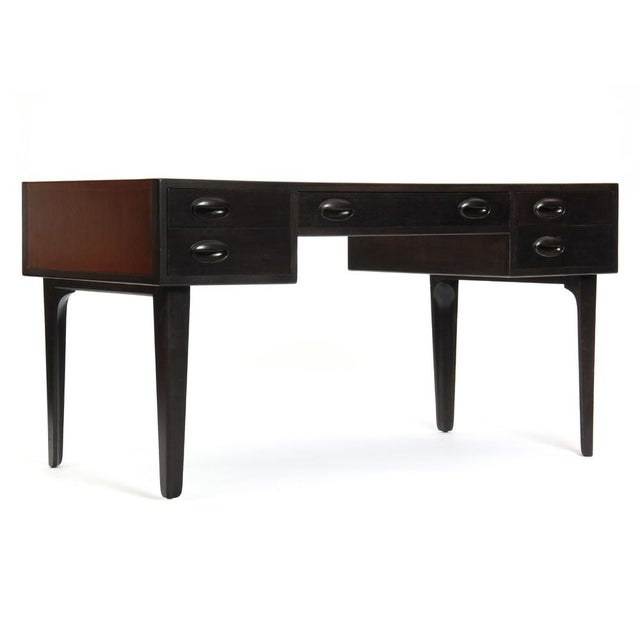 Rare rosewood and macassar ebony wood partners desk by Edward Wormley for Dunbar, circa 1945 This item includes restricted...