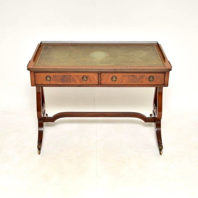 A gorgeous antique Regency style leather top desk / writing table. This was made in England, it dates from around the...