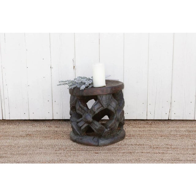 This antique African Bamileke stool, originally use as a throne is hand carved from a single wood log with a waxed finish....