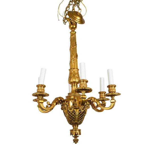 This Louis XV-Style Six-Arm Gilt Bronze Chandelier is an elegant interpretation of the lavish decorative arts that defined...