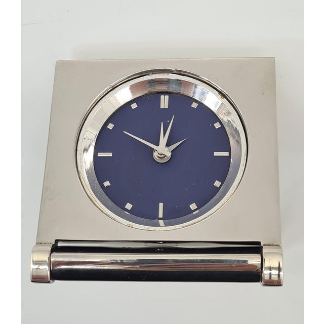 An original, collectible Mercedes-Benz travel watch, featuring a distinctive, compact chrome-plated metal case. The watch...