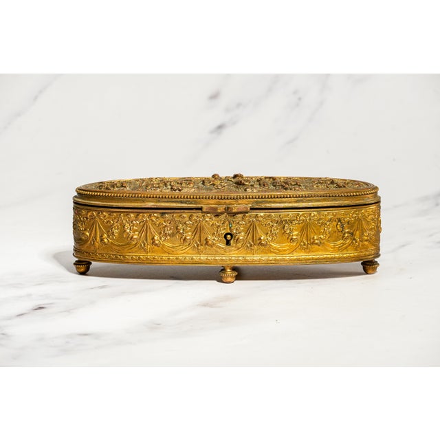A wonderfully decorative antique French jewelry casket dating to circa 1900, this substantial oblong box is an exceptional...