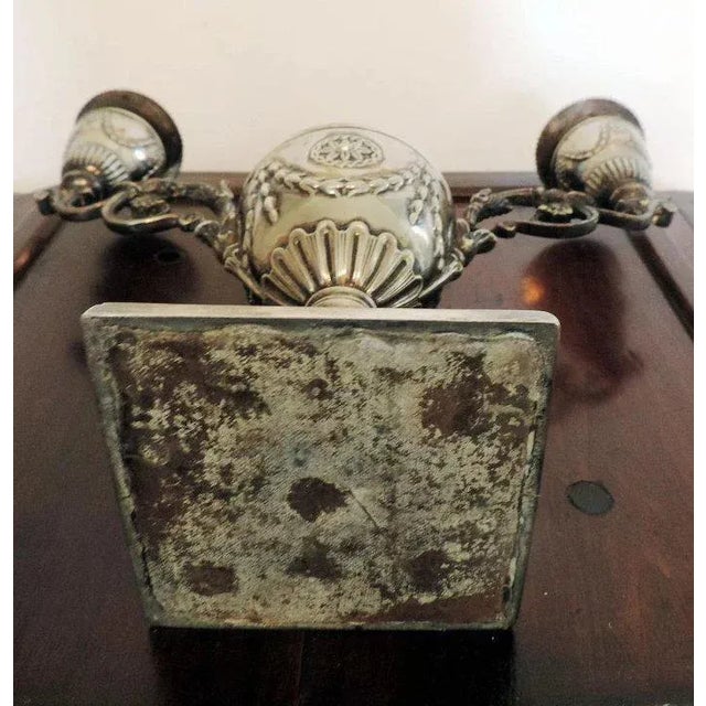 Pair 19th c. Sheffield silver plate urn form candlesticks. Each having a central urn in the Adam taste with hinged lid...