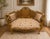 Add a touch of timeless French elegance to your interior with this exquisite Louis XV–style settee. Featuring an ornate...