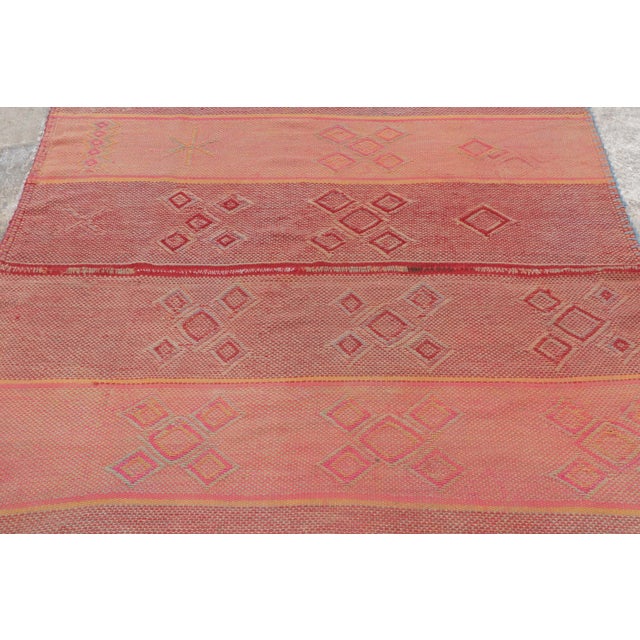 Hand-woven in wool circa 1950–1960, this 5x5 square vintage Peruvian Kilim—traditionally known as a Frazada—is a luminous...