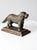 Antique brass nutcracker modeled in the form of a dog, sculptural in presence with a warm, timeworn character. Cast in...
