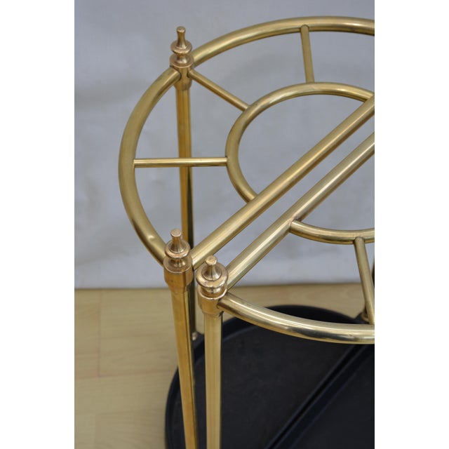 Matched pair of early xxth century / vintage umbrella stands of demi lune design, each having five walking sticks or...