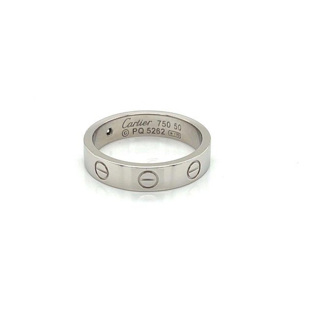 The Cartier Mini Love 1 Diamond 18k Gold Band Ring is a luxurious and elegant piece of vintage jewelry. Featuring a single...