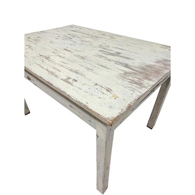 Mid Century design circa 1950’s table, which is made from a combination of both Beech & Pine, finished in distressed white...