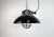 Industrial hanging lamp manufactured by Elektrosvit in former Czechoslovakia during the 1960s. It features a black enamel...