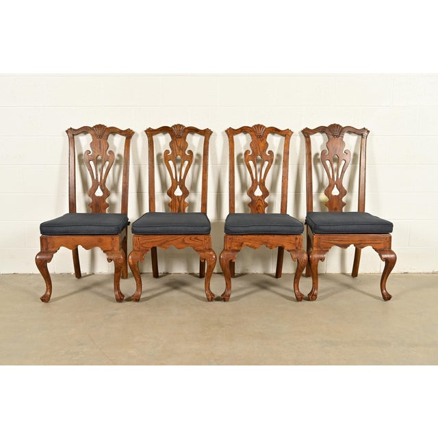 An outstanding set of four Chippendale or Georgian style side chairs or dining chairs By Henredon USA, Circa 1980s Carved...