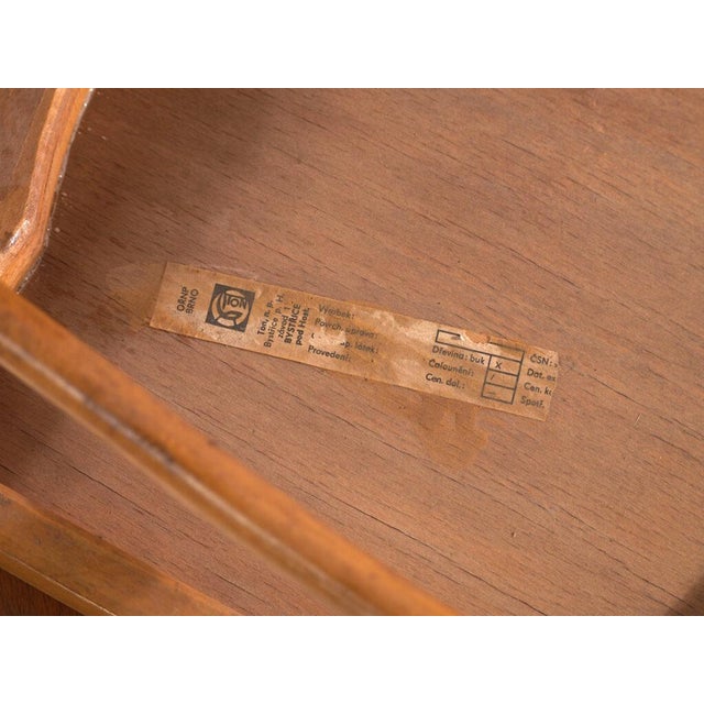 A set of two antique chairs in bentwood, with a curved crest rail over vertical splats and a moulded board seat....