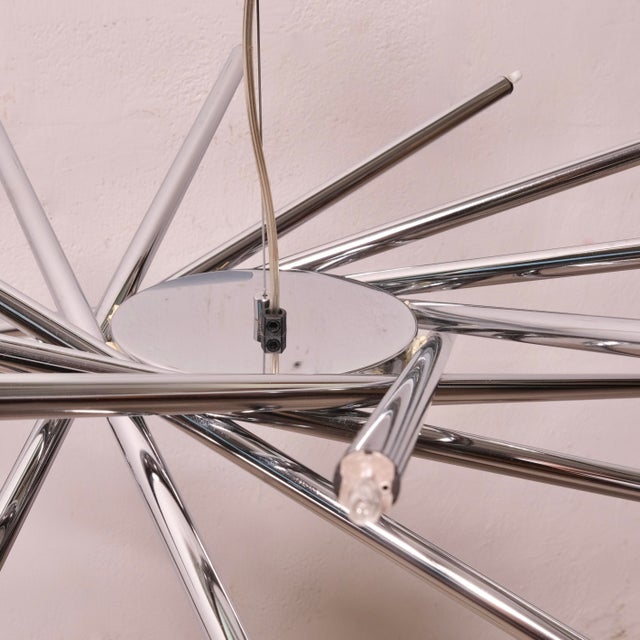 The Bilumen chandelier was designed by Marco Zotta in the early 1990s. The lamp is composed of multiple tubes, with light...