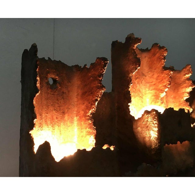 Brutalist wall lamp in a sculptural design. A rare collector's item. The lamp is made of ceramic, which has been glazed in...