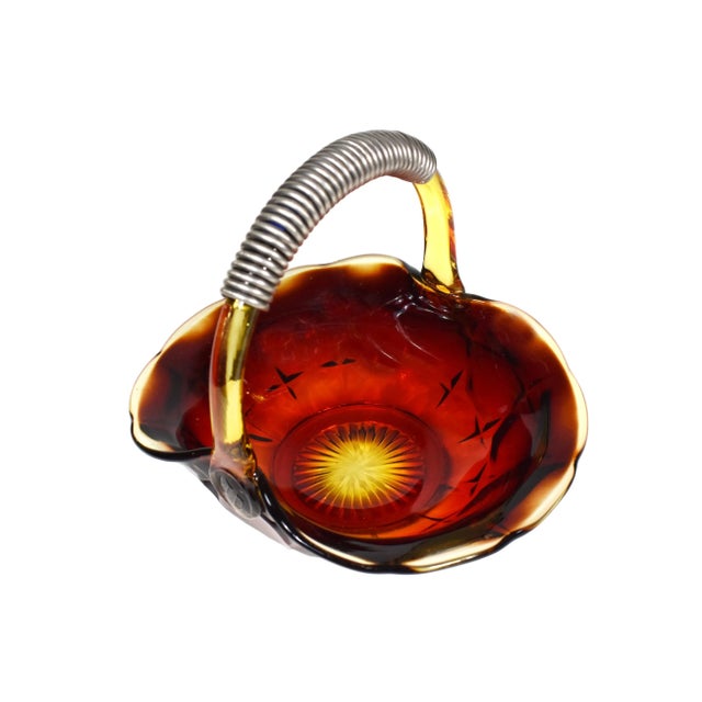 This excellent vintage Brides Basket is made of glass with metal wrapped handle. This stunning glass Basket has...