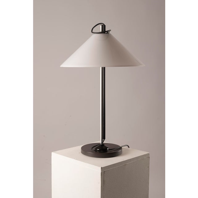 Iconic “Aggregato Tavolo” table lamp, designed in 1974 by Enzo Mari and Giancarlo Fassina for Artemide, Italy. The...