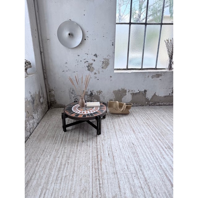 A vintage coffee table from the 1960s by Roger Capron, featuring his "Herbier" design. We love its round shape, with its...
